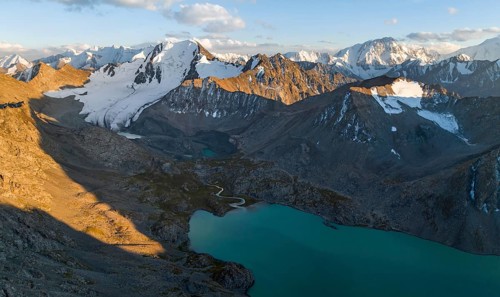 Evening mood, mountain panorama, aerial view, 4000 metre peak with glacier, mountain pass and