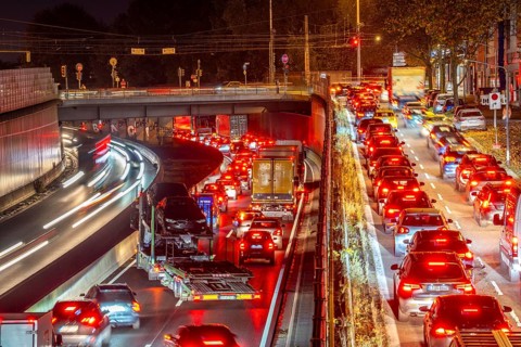 Evening traffic, partly with congestion, slow-moving traffic on the A40 motorway, traffic jam