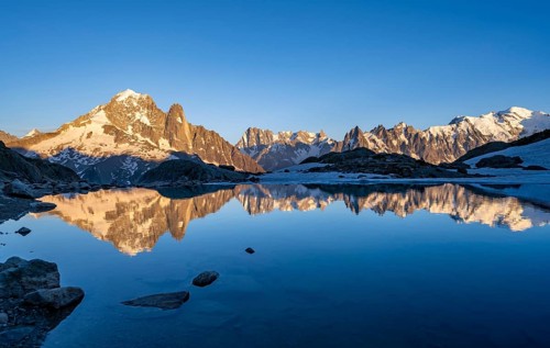 Evening mood, mountain landscape at sunset, alpenglow, water reflection in Lac Blanc, mountain