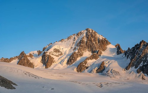 High alpine mountain landscape at sunset, summit of the Aiguille de Chardonnet and Glacier du Tour