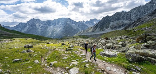 Mountaineer on a hiking trail, mountain landscape near Arolla, ascent to Col de Riedmatten, Valais,