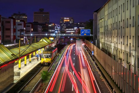 Essen, North Rhine-Westphalia, Germany, A40 motorway in the city centre at dusk. Underground line