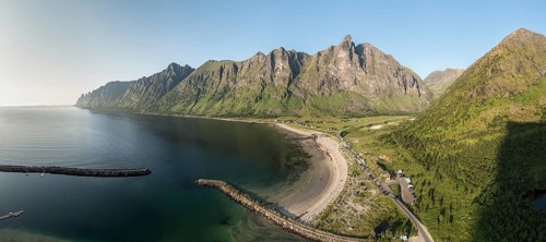 Panoramic aerial view of campsite at beach Ersfjordstranden, fjord Ersfjord, golden restroom, Senja
