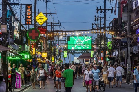 Crowds of people on Bangla Street in the evening. Nightlife on Bangla Walking Street with go-go