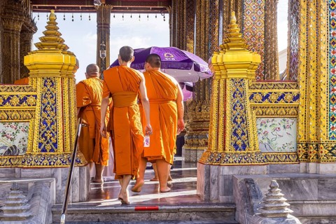 Wat Phra Kaeo temple, royal palace. Royal chapel with Buddhist monks and novices. Bangkok,
