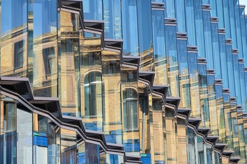Robert Koch Forum reflected in glass façade opposite, Hertie School private university, building