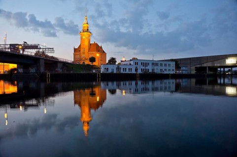 The old harbour office in the neo-renaissance style in the harbour in Dortmund at dusk, North