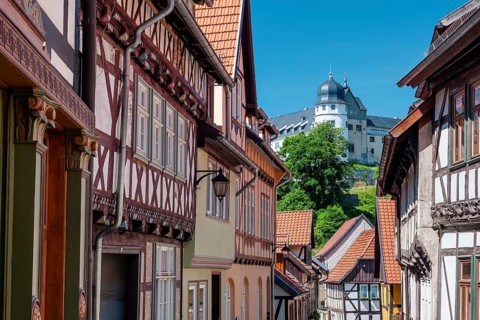 Street with half-timbered houses in the old town, the castle in the background, Stolberg im Harz,
