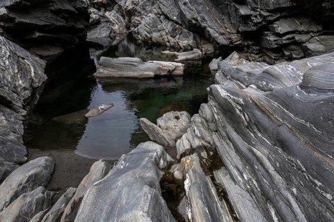 Rocks, granite rock formations in the Maggia River near Ponte Brolla, in the Maggia Valley, Valle