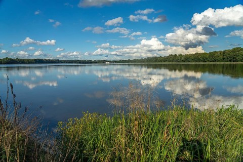 Clouds reflected in the Danube reservoir Faimingen, Lauingen Donau, Bavaria, Germany, Europe