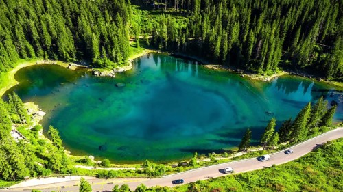 Aerial view capturing the stunning turquoise waters of alpine lake karersee reflecting the