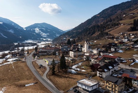 Drone shot, view of village with parish church, Rangersdorf, Mölltal, Carinthia, Austria, Europe