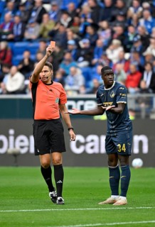 Referee Tobias Reichel shows Stanley Nsoki TSG 1899 Hoffenheim (34) red card red sending off,