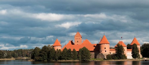 Island castle in Trakai, Lithuania with a cloudy sky in the background
