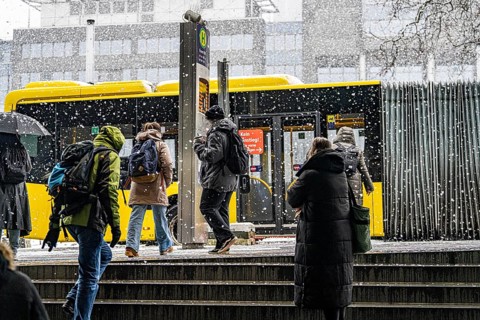 Winter weather, heavy snowfall, passengers waiting for the bus in the snow, at Essen central