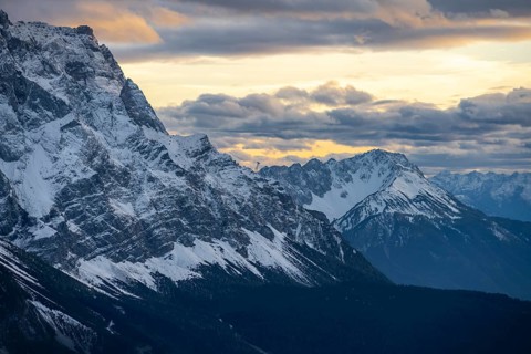 Mountain peak of the Zugspitze with snow in autumn, Wetterstein mountains at sunset, view from
