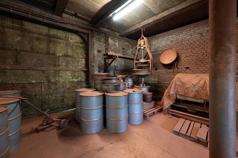 Metal barrels in the bronze powder filling room of a metal powder mill, founded in 1900, Igensdorf,