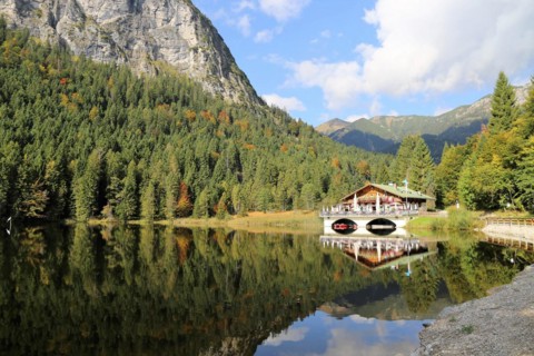 The picturesque Pflegersee lake near Garmisch, with the mountain inn in the background