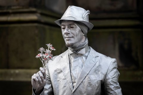 Street artists sprayed with silver paint, world's largest cultural festival The Fringe, High