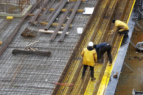 Construction site, reinforced concrete reinforcement bars, for a building ceiling, are installed