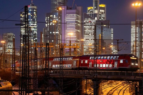 Railway tracks in front of the main railway station in Frankfurt am Main, skyline of skyscrapers in