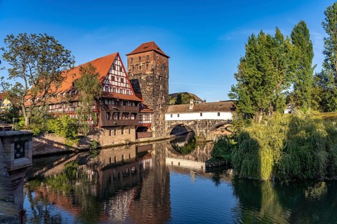 Half-timbered house Weinstadel and water tower on the Pegnitz in Nuremberg, Bavaria, Germany,