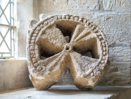 Head of ancient stone cross discovered in churchyard, church of Saint Michael, Yanworth,