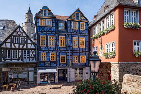 The leaning house, half-timbered house, colourfully painted, witches' tower, town hall, King Adolf