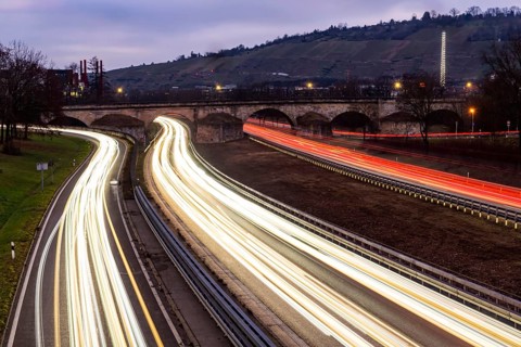Multi-lane road at night with Plinsau bridge, arch bridge over the Neckar. Federal road B10 in