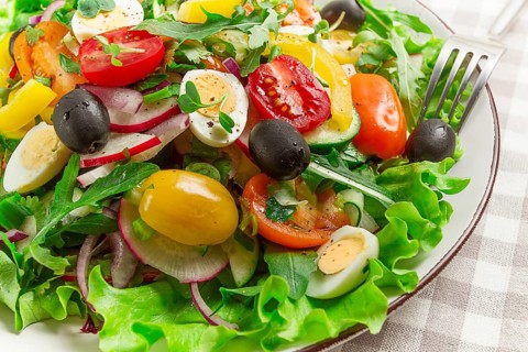 Vegetable salad, with quail eggs and olives, fresh, close-up, no people