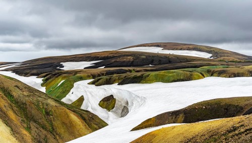 Colourful volcanic landscape with hills and snow, Laugavegur trekking trail, Landmannalaugar,