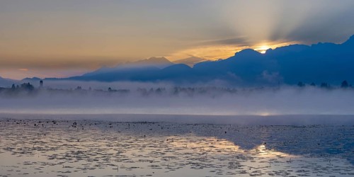 Sunrise at Lake Hopfensee near Füssen, behind Hopfen am See, the Tegelberg massif and the Säuling,