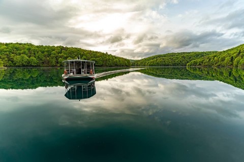 Electric tourist boat on the largest lake Kozjak in Plitvice Lakes National Park, Croatia, Europe