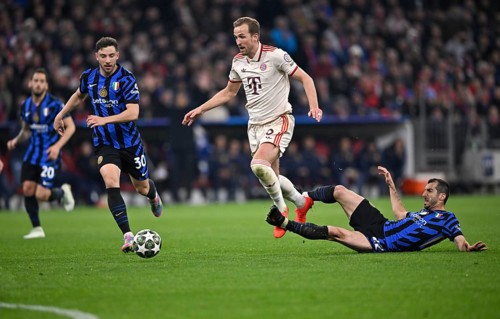 Tackle, action foul Henrikh Mkhitaryan Inter Milan (22) on Harry Kane FC Bayern Munich FCB (09)