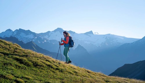 Hiker enjoying the mountain panorama in the morning, Venediger group, behind Dreiherrenkopf,