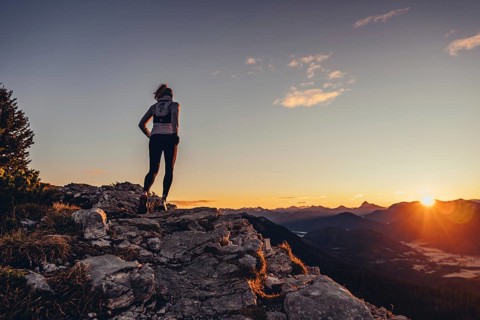 Trail running in autumn on the Jochberg on Lake Walchensee against the wonderful backdrop of the