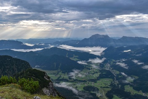 View from Edelweißlahner to the valley basin of Ramsau and Berchtesgaden with fog and sunbeams,