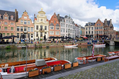 Tourist boats moored along the Graslei, Ghent, Flanders, Belgium, Europe