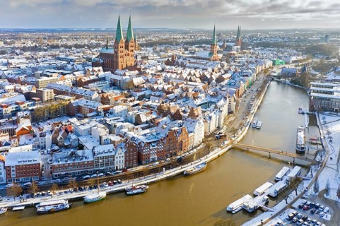 Aerial view over the river Trave and church towers in the old town of the Hanseatic City of Lübeck