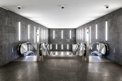 Tunnel subway illuminated with LED light with escalators to the Museumsinsel underground station,