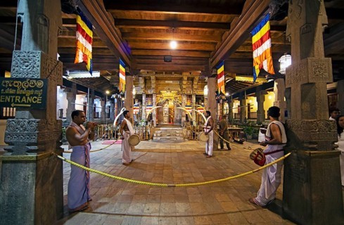 Drummers and flute players at a shrine in the Buddhist Temple of the Tooth or Sri Dalada Maligawa,