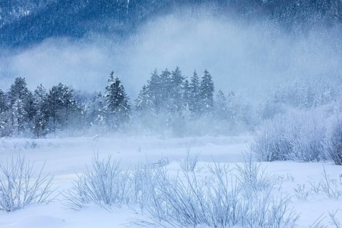 Isar valley in winter at temperatures of minus 18 degrees Celsius. Snow covered landscape with the