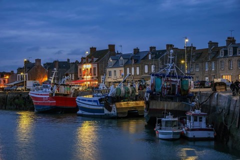 Barfleur, Normandy, France - Fishing boats on the quay in the harbour of Barfleur, a picturesque