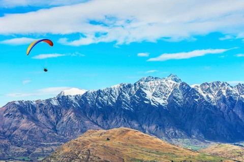 Paragliding over the Remarkables mountain range, Queenstown, South Island, New Zealand, Oceania