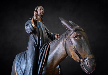 Christ on the palm donkey, detail on dark background, wooden figure from around 1880, Dominican