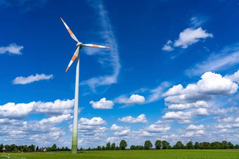 Wind turbine, wind energy plant from the manufacturer Enercon, blue sky with many white clouds,