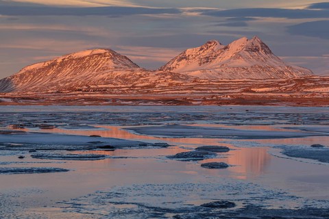 Morning light on Bergen on the coast, icy fjord, Breiddalsvik, East Fjords, Iceland, Europe