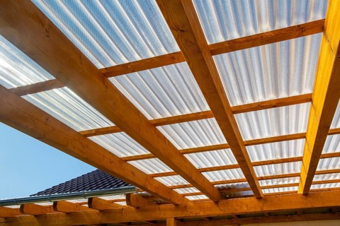 New patio roofing with wood and corrugated acrylic glass panels