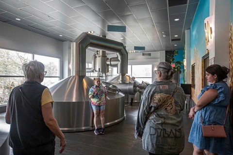 Covington, Louisiana - The Abita Brewing Company's craft beer brewery. A tour guide explains the