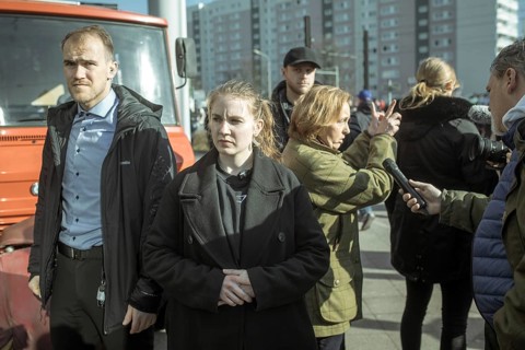 Bodyguards and Beatrix von Storch (in the background) at the final rally of Beatrix von Storch and